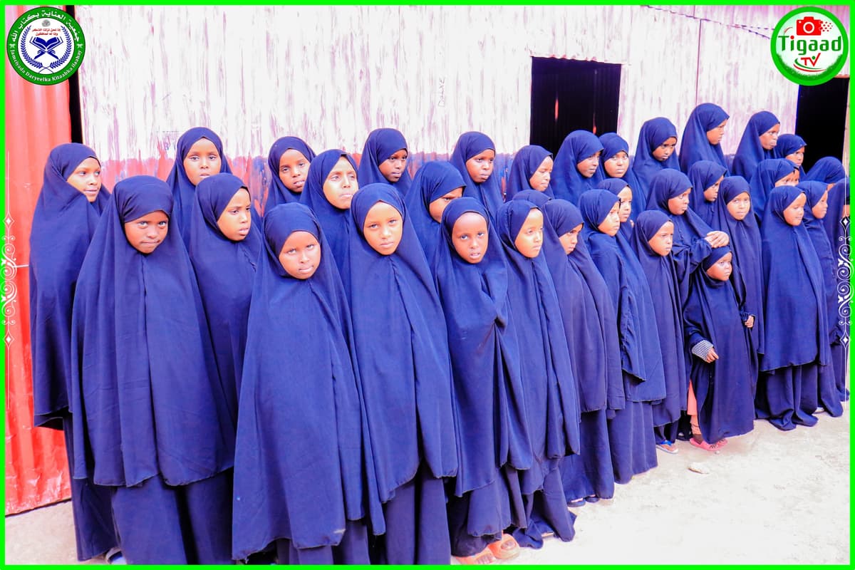 Orphan girls in navy hijabs